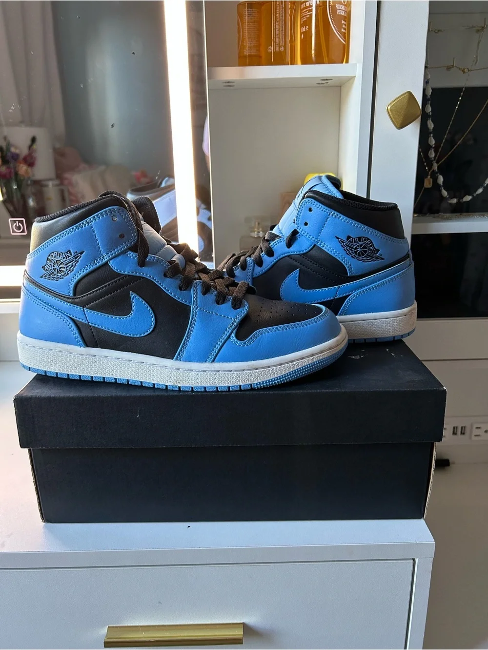 Jordan Air 1 High-Top Sneakers in Black and Blue